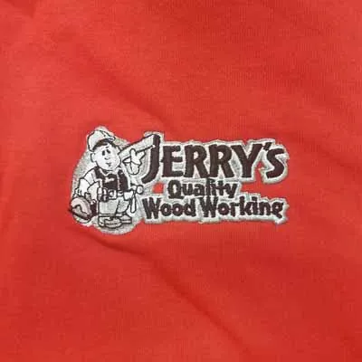 Jerry's Quality Wood Working logo embroidered on a red shirt