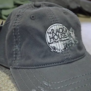 Rack House logo embroidered on a grey trucker hat