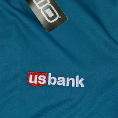 U.S. Bank logo embroidered on a teal polo