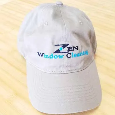 Zen Window Cleaning logo embroidered on a white cap