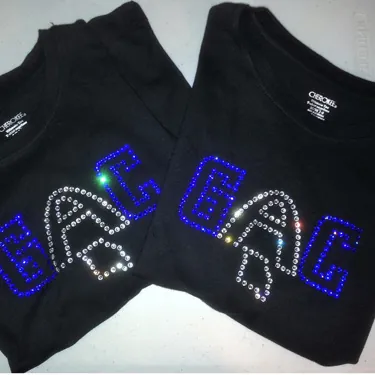 GAC rhinestone lettering on black apparel