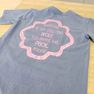 Timberland Wolves quote printed on the back of a grey shirt