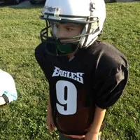 Youth football player in a jersey with vinyl number 9
